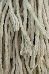 close up of a floor mop strings