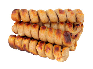 Grilled turkey twizzlers, turkey meat formed into spirals isolated on a white background
