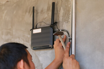 Technicians are installing Wi-Fi and fiber optic cables.