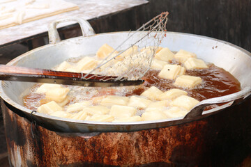 Bolang-baling is fried bread made from wheat flour with good taste, generally sold on the side of the road.