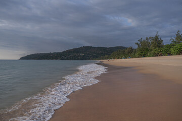 Rain clouds over the beach during sunset