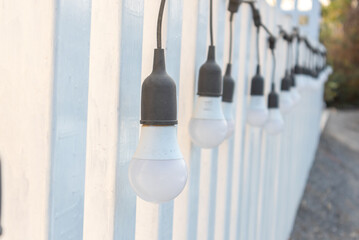 lightbulb switch off hang on the wall outside home