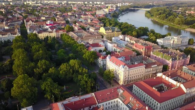 Cinematic aerial drone footage of downtown and Elisabeth Park in Szeged, a charming historical European city on the banks of the Tisza river on the Southern Great Plane of Hungary