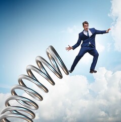 Businessman jumping from spring in promotion concept
