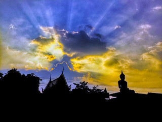 Silhouette of Buddha statue at twilight time with amazing sky in Thailand ,religion,