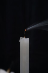 Stock photo of candles dying after being blown out in the dark during a power failure. suitable for...