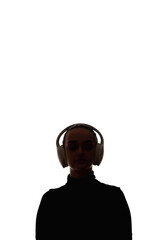 Female silhouette. Audio sound. Modern technology. Dark contrast outline portrait of relaxed woman enjoying listening to music in wireless headphones isolated on white copy space background.