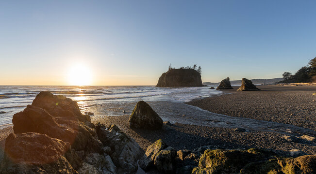 Sunset along the rugged coast of Washington on Ruby Beach in Olympic National Park.