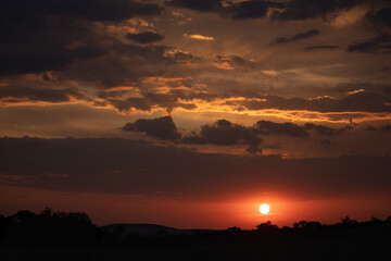 sunset with red and orange clouds in Africa