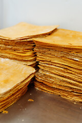 layers of dough for making a cake. The thin crust is crispy.