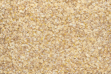 background of oatmeal flakes and other cereals. Oatmeal, wheat, barley, millet flakes.