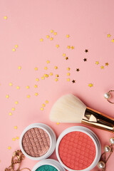 Obraz na płótnie Canvas Professional cosmetics makeup decoration accessories pink background
