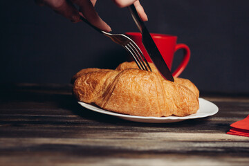 crispy croissants on a plate wooden table coffee mug breakfast