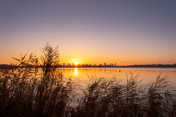 Sunset over lake Kralingse Plas in Rotterdam, the Netherlands, as seen from the promenade on the...
