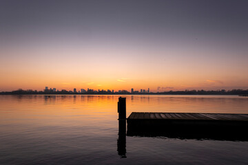 Fototapeta premium Sunset over lake Kralingse Plas in Rotterdam, the Netherlands, as seen from the promenade on the eastern shore
