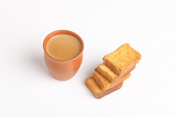 Fototapeta na wymiar Indian breakfast. tea and rusk on white background.
