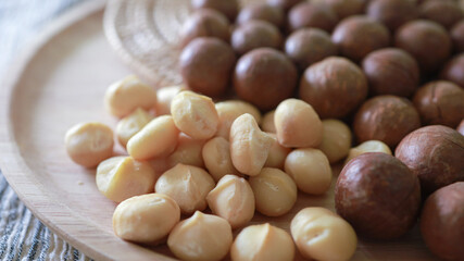 Organic Macadamia nut. macadamia nuts are cracked and baked to taste extremely delicious superfood fresh natural shelled unsalted raw macadamia and healthy food concept