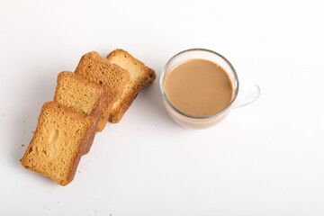 Rusk or bread toast with cup of tea on white background.