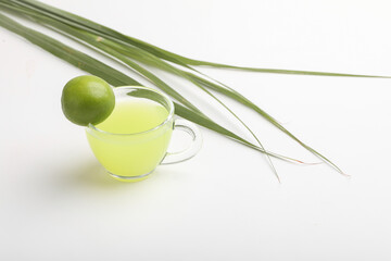 green tea with lemon on white background.