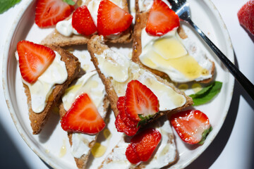 Healthy food breakfast strawberry toast with butter cream