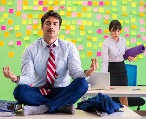 Man and woman in the office with many conflicting priorities in