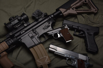 Weapons and military equipment for army, Assault rifle gun (M4A1) and pistol on green military...