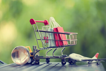 Online shopping, e-commerce concept: Paper shopping bags in a trolley or shopping cart in the...