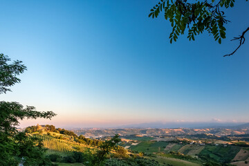 Beautiful sunset on the countryside of Marche in a summer evening