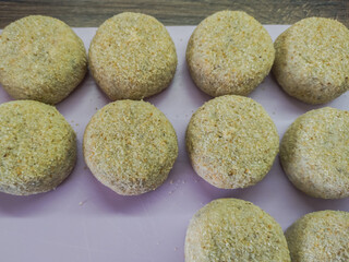 Semi-finished raw meat cutlets ready for cooking