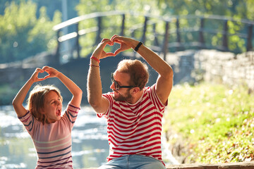 Obraz premium Daughter and father enjoying outdoors nature.