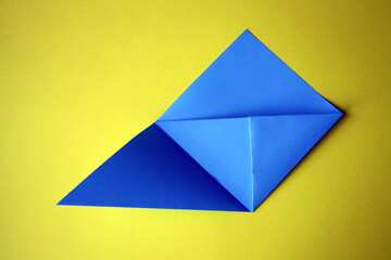Step-by-step photo instructions. How to make an origami paper bookmark for a book. Classes with children. DIY. Step 7