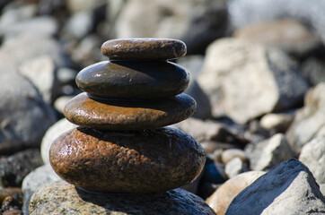 Fototapeta na wymiar balance, cairn. stones by the river