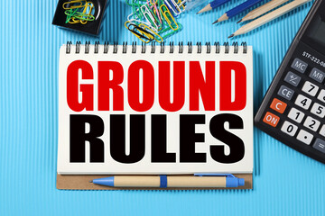 ground rules. TEXT ON WHITE NOTEBOOK PAPER on blue background near calculator