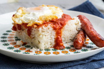 Rice with tomato and fried egg. Cuba style rice.