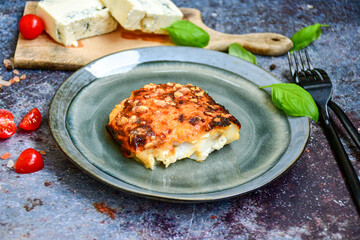  Fish bake preparated in Ticino style  with sweet gorgonzola  cheese and tomato crust