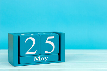 wooden calendar with date May 25 on blue wooden background, World Thyroid Day; International Step Day; International Day of the Missing Children