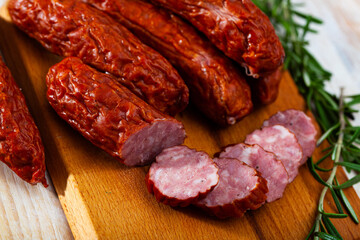 Roasted chezh sausages susena on cutting board. High quality photo