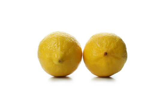 Two ripe lemons isolated on white background