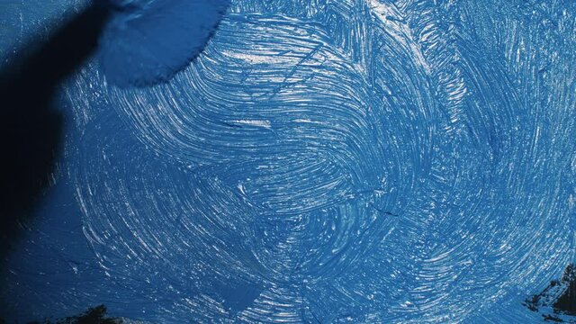 Artist copyist paint seascape with ship in ocean. Craftsman decorator draw as boat sail on blue sea with acrylic oil color. Draw finger, brush, knife.