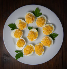 Stuffed eggs with crab crumbs, mayonnaise and parsley macro on a plate, High quality photo