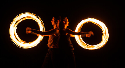 Creating awesome tracer effects. Couple of artists perform fire orbitals. Bright light trails and...