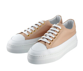 Pair of powder-colored leather athletic shoes with laces and a white high sole, isolated on a white background.
