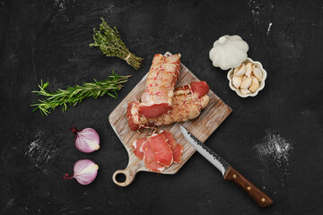 Overhead view of smoked beef ham on cutting board