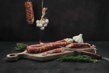 Beef sun-dried sausage on cutting board