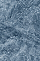 Fototapeta premium Ice background texture. Frozen water in various geometric abstract shapes. Seasonal natural effect. Cold weather. The surface of the winter water reservoir.