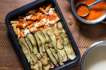 Baked pasta with fried eggplant slices with vegetarian ragout.