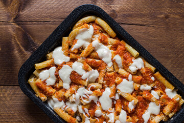 Baked pasta with fried eggplant slices with vegetarian ragout.
