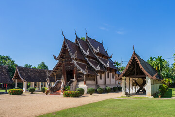 Beautiful traditional Lanna art wooden chapel church at Wat Intharawat or Ton Kwen Temple in Chiang Mai, Thailand