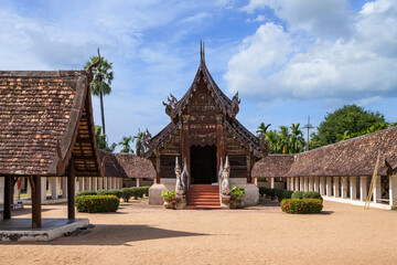 Fototapeta na wymiar Beautiful traditional Lanna art wooden chapel church at Wat Intharawat or Ton Kwen Temple in Chiang Mai, Thailand