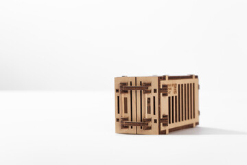 Toy wooden port container with motorcycle inside